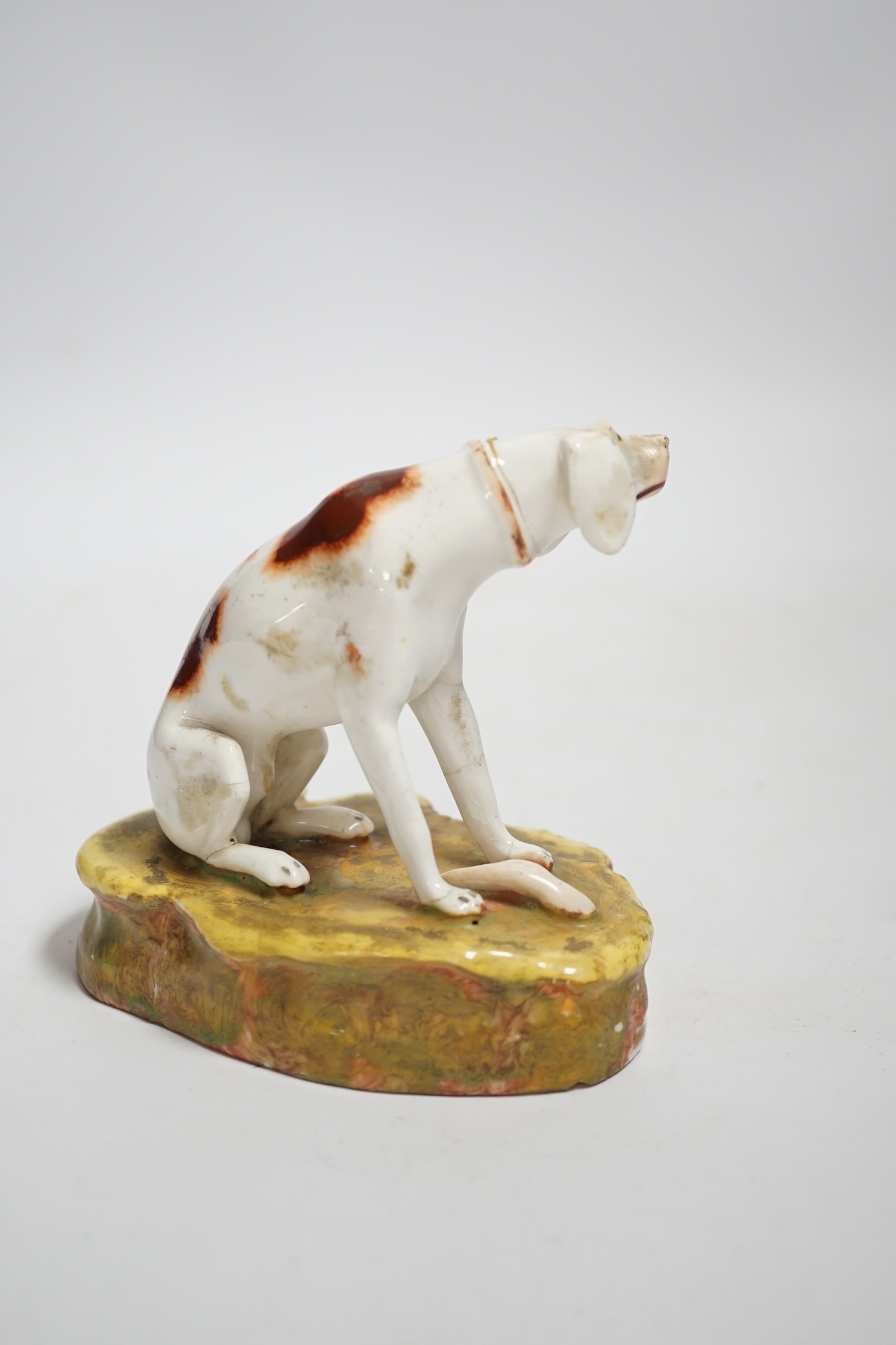 A rare Staffordshire porcelain model of a pointer, c.1830-50, 10cm high